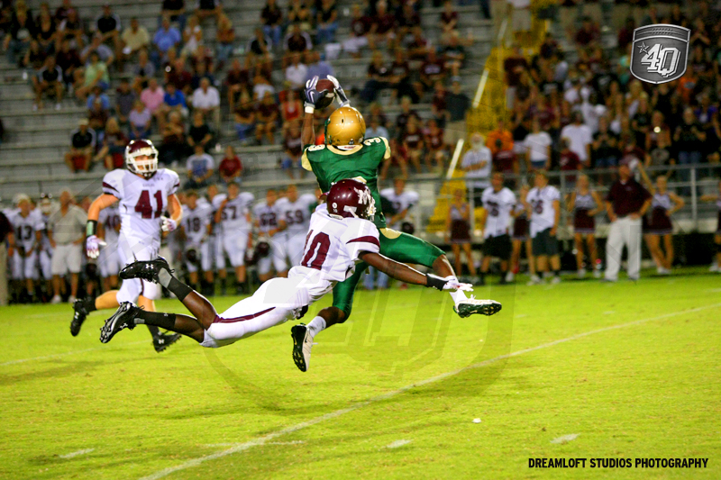 Lincolns Keondrick Daniels catches the ball at the 20 yardline and carries it in for a Trojan Touchdown